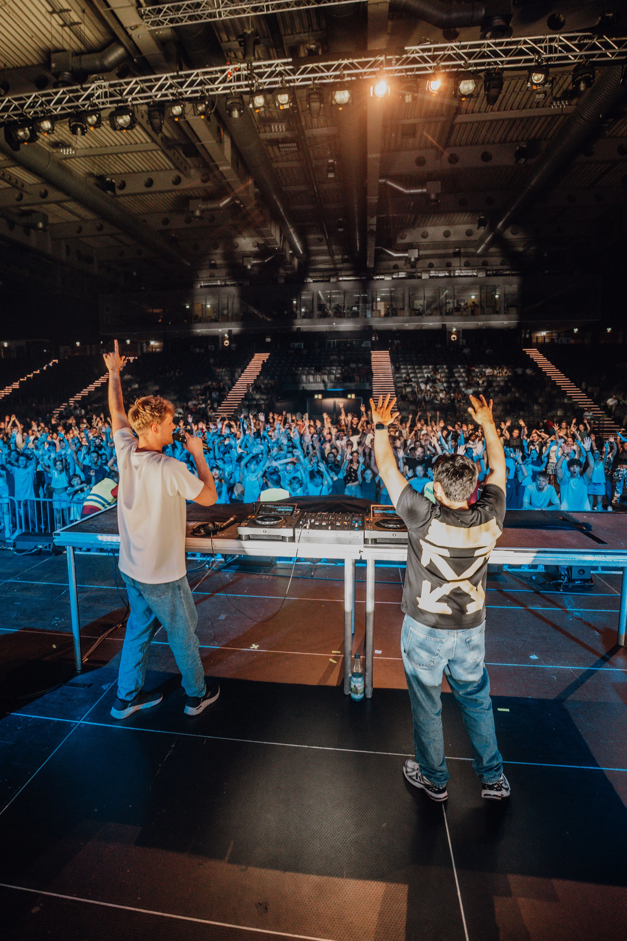 Lukas Goss and DJ Jesus Loves Electro with their hands raised in front of the crowd at BUJU 2026